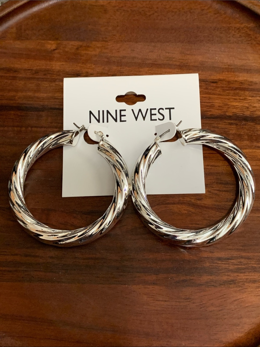 NWT Nine West silver tone twisted hoop earrings
